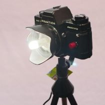 LED camera lamp, made from a Praktica BC1 electronic camera with power supply and tripod about