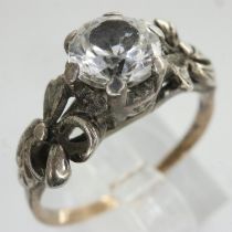 9ct gold solitaire white topaz solitaire ring, the central bright stone within a floral design