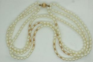 Triple strand choker of pearls, with a 9ct gold clasp and gold spacers, L: 40 cm. UK P&P Group