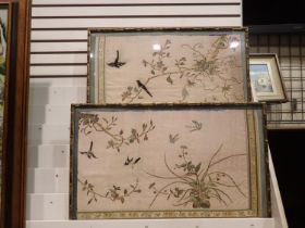 Pair of early 20th century embroidered silk panels within bamboo style frames, each 66 x 43 cm.