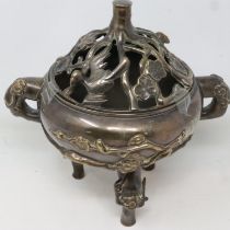 Large 20th century Chinese bronze censer with pierced cover, decorated throughout with vines and