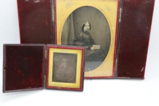 Victorian leather bound folding photograph frame, 20 x 12 cm, and a leather cased daguerreotype.