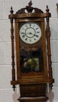 Late 19th/early 20th century American wall clock, chiming on a bell set within an inlaid walnut