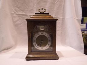 Elliott burr walnut cased table clock for Boodle & Dunthorne, not working at lotting, H: 27 cm. UK