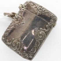 Hallmarked silver vesta case, the body of ogee form and with relief decoration, Birmingham assay,