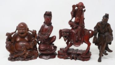 Four carved Chinese figurines, largest H: 20 cm. UK P&P Group 3 (£30+VAT for the first lot and £8+