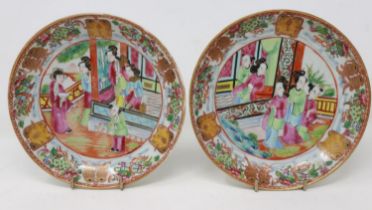 Pair of 19th century Chinese Canton saucers, each with figural scenes and gilt detail, D: 14 cm.