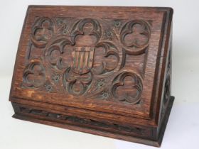 Oak fitted stationery box with carved lid, H: 24 cm. Not available for in-house P&P