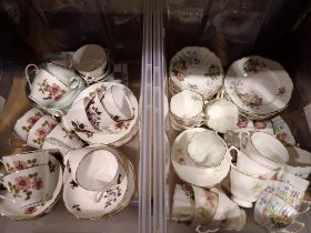 Two boxes of mixed ceramic tea services to include Colclough and Royal Garden. Not available for