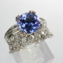 18ct white gold ring set with tanzanite and diamonds, size I/J, 5.1g, approximately 1.1 carat. UK