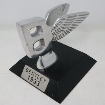 Polished aluminium Bentley B on a base, H: 13 cm. UK P&P Group 2 (£20+VAT for the first lot and £4+