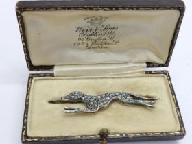 Unmarked gold greyhound form brooch set with rose cut diamonds, L: 47 mm, 4.1g. UK P&P Group 0 (£6+