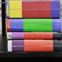 Four hardback Harry Potter books, including three first editions. UK P&P Group 2 (£20+VAT for the