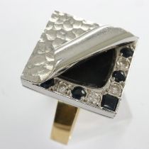18ct gold ring set with onyx, diamonds and sapphires on a D shaped shank, size K, 11.0g. UK P&P