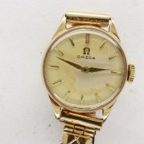 OMEGA: 9ct gold cased ladies wristwatch on an expanding bracelet, 14.2g, working at lotting,