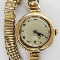 Ladies 9ct gold 15 jewel wristwatch on a yellow metal bracelet, inscribed 9ct, total 21.1g, not