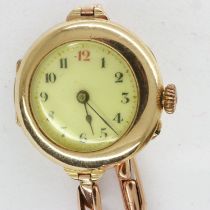 Ladies 9ct gold wristwatch on a 9ct gold bracelet, total 20.0g, not working at lotting. UK P&P Group