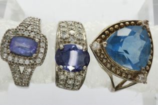 Three 925 silver rings set with amethyst and topaz, mixed sizes. UK P&P Group 0 (£6+VAT for the