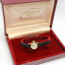 LONGINES: ladies 9ct gold cased wristwatch on a black leather strap, working at lotting, boxed. UK