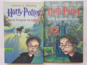 Two German first edition Harry Potter paperback books, Chamber of Secrets and Prisoner of Azkaban.