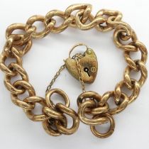 Yellow metal heavy gauge bracelet with rolled gold padlock clasp, L: 18 cm, 45g. UK P&P Group 0 (£