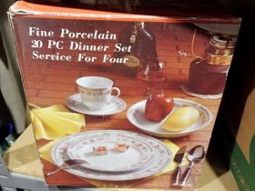 Fine porcelain 20 piece dinner service, boxed, appears unused. Not available for in-house P&P