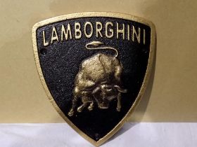 Cast iron Lamborghini plaque. W: 17 cm. UK P&P Group 1 (£16+VAT for the first lot and £2+VAT for