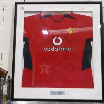 2004-05 Manchester United shirt bearing team signatures, professionally mounted and framed, with