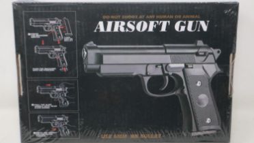New old stock airsoft pistol, model V22 in black, boxed and factory sealed. UK P&P Group 1 (£16+