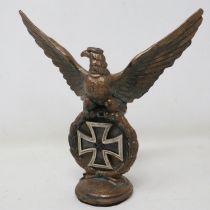 Third Reich brass desk eagle, surmounted with an original 3-part construction Iron Cross with an