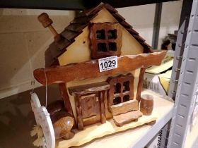 Handbuilt wooden coin house. Not available for in-house P&P
