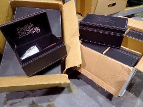 Two boxes containing eight real leather tea boxes from the English tea shop. Not available for in-