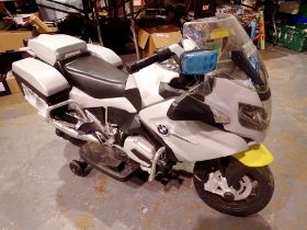 Childs ride on BMW GS police bike, working at lotting with charger present. Not available for in-