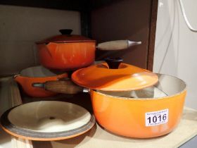 Four Le Crueset volcanic orange saucepans. Not available for in-house P&P