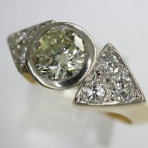 18ct gold diamond ring, the 1.1cts brilliant cut bezel set centre stone flanked by diamond set