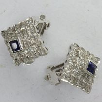 Pair of 18ct white gold clip-on earrings, set with princess cut sapphires and diamonds, combined 7.