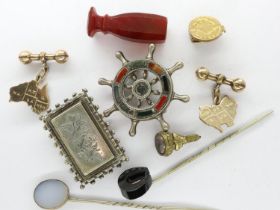 Collection of antique and vintage jewellery, including an onyx horseshoe stick pin, intaglio fob
