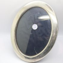 Oval hallmarked silver mirror, Sheffield assay, H: 22 cm, small crack to glass. UK P&P Group 3 (£