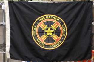 PMC Wagner Russian private military company flag, being a trophy recovered from the current
