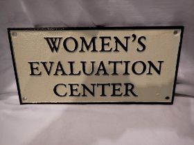 Cast iron womens evaluation centre sign W: 27 cm. UK P&P Group 1 (£16+VAT for the first lot and £2+