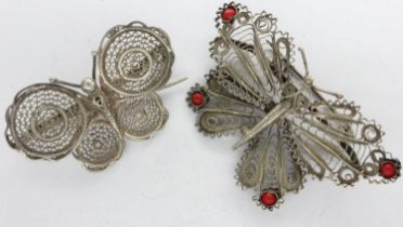 Two white metal filigree butterfly brooches, one set with coral, largest L: 60 mm. UK P&P Group
