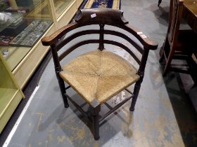 Oak framed carver chair with rush seat. Not available for in-house P&P