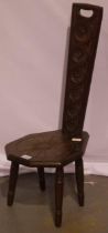 A 20th century carved oak spinning chair in the traditional style, H: 86 cm.