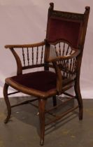 A late Victorian elbow chair with turned and carved frame, impressed M or W to underside.