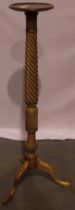 An Edwardian walnut Torchere, with tapering twist stem and tripod supports, H: 135cm, top D: 28cm.