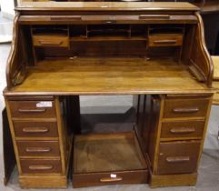 Oak twin pedestal roll top bureau with seven drawers and fitted interior, for restoration, 122 x