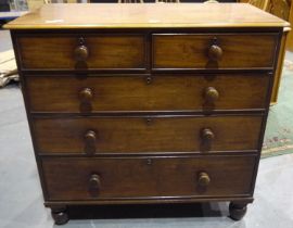 A Victorian walnut chest of two short above three graduated long drawers, raised on turned supports.