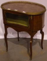 A French 19th century inlaid walnut kidney-shaped vitrine, ormolu mounted, with silk lined interior,