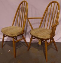 A set of six (4+2) Ercol Windsor stick-back dining chairs with upholstered seat cushions.