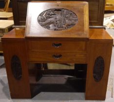 A Chinese carved hardwood fall-front bureau with fitted interior, two side cupboards and two drawers